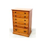 A modern pine narrow chest of six drawers on plinth base, height 109cm.