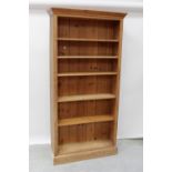 A modern pine plank back floor-standing open bookcase with adjustable shelves, height 198cm.