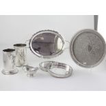 A quantity of plated ware to include a circular tray with chased decoration and gallery rim,