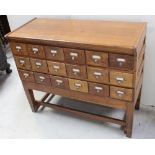 An early 20th century three-section oak library table/filing cabinet,