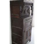 A late 18th/early 19th century oak court cupboard, carved top panel,