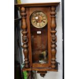 A beech and walnut Vienna-style wall clock (lacking pediment, but with pendulum),