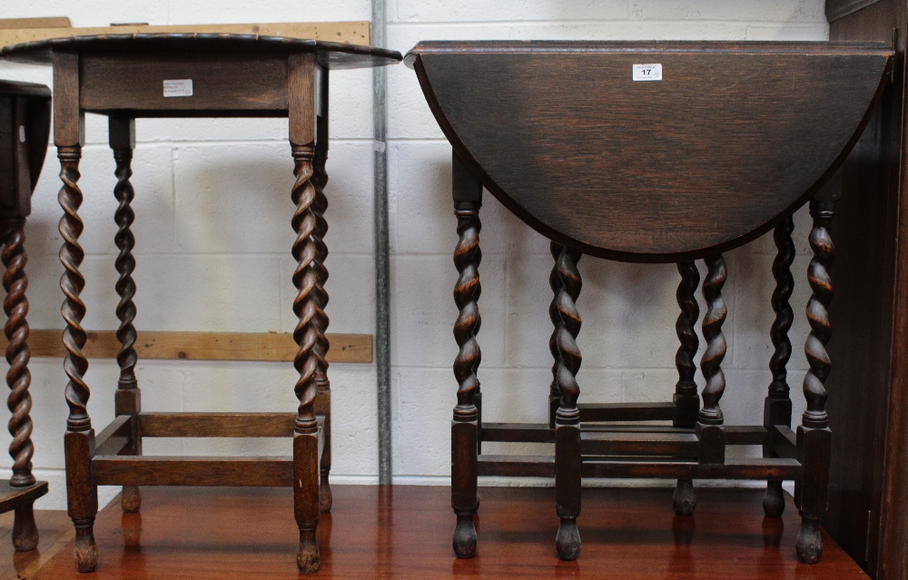 An early/mid-20th century oak barleytwist drop-leaf table with matching stain and a similar