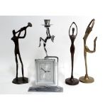 Two modern bronze cast figures, one as a trumpeter, the other a dancer, a brass figure of a dancer,