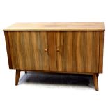 A mid-20th century walnut Cumbrae two-door sideboard produced by Morris of Glasgow, width 139cm.