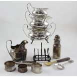 A small group of 18th century and later silver items to include an Irish helmet-shaped silver milk