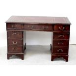 A modern mahogany twin-pedestal box-top desk with tooled burgundy leather skiver,