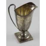 A George V hallmarked silver helmet shaped milk jug, Chester 1923, approx 5.1ozt.