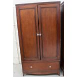 A Laura Ashley style double wardrobe with glass handled panelled doors over a single-drawer base,