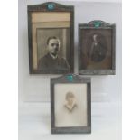 Three early 20th century Arts & Crafts pewter photograph frames with beaten and raised decoration,