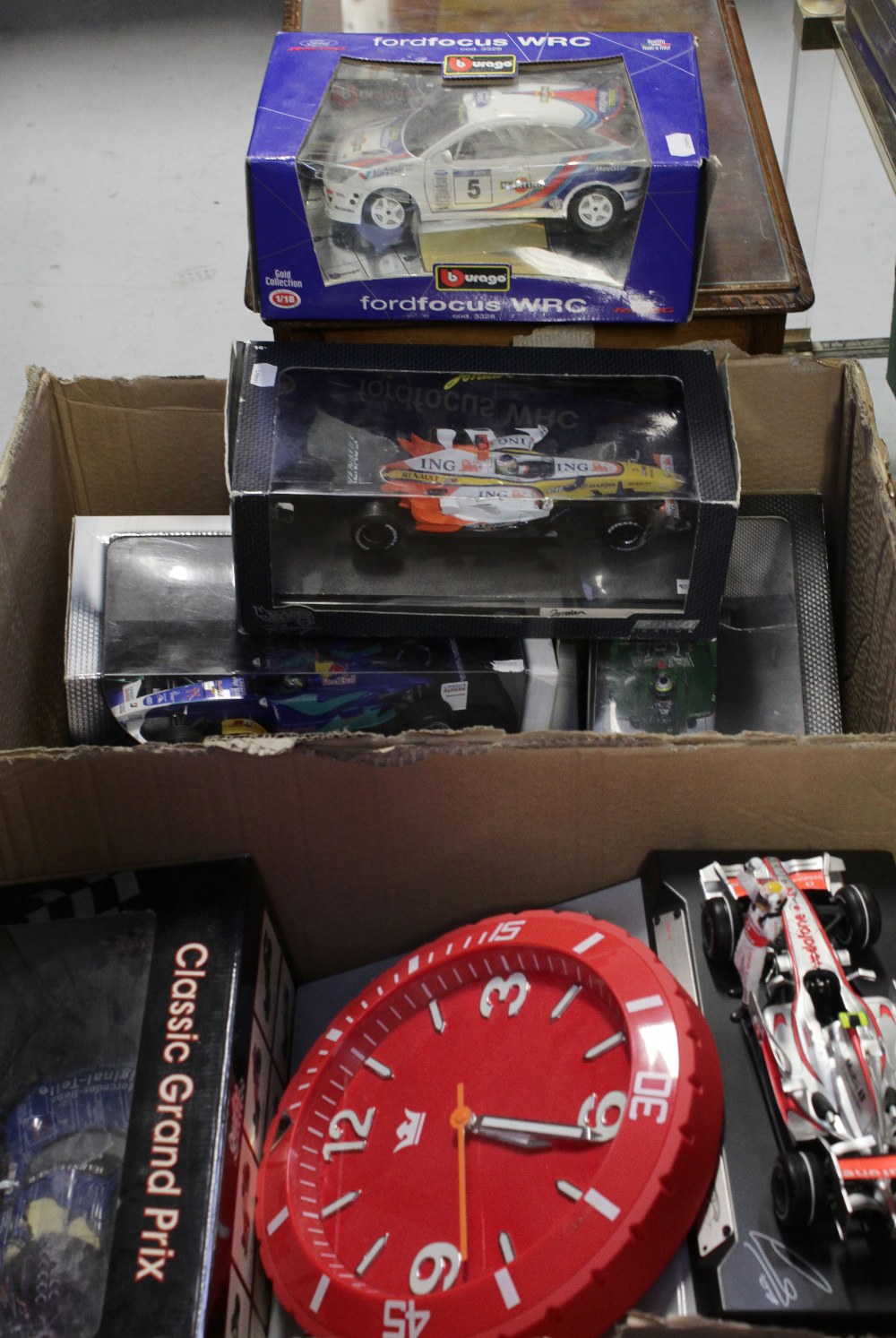 A selection of diecast and plastic scale model racing cars and other vehicles by factories to