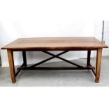 A 20th century walnut refectory-style table, the plank top supported on X-frame base, length 200cm.