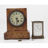 A Biedermeyer walnut mantel clock of rectangular form,