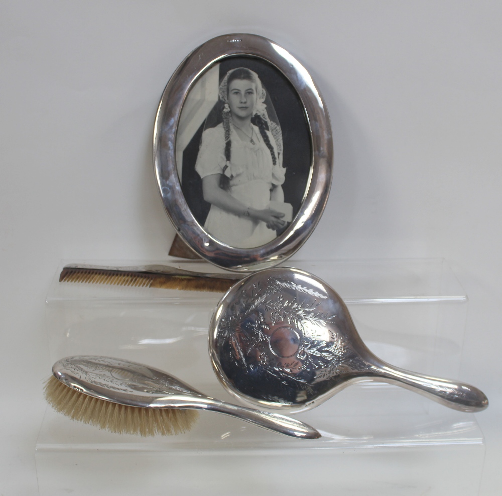 A George V hallmarked silver oval picture frame,
