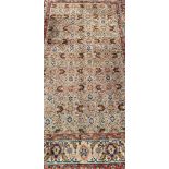 An antique Persian hand made Tabriz rug, 208 x 136cm.