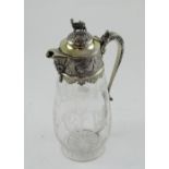 A Victorian hallmarked silver gilt and crystal claret jug,