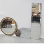 Three mid/late 20th century frameless wall mirrors including one small circular example,
