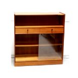 A modern teak Parker Knoll floor standing bookcase with open book well surmounting two central