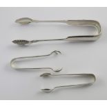 A pair of Victorian silver sugar tongs with anthemion chased bowls,