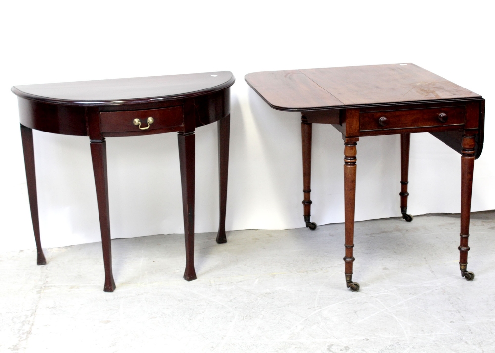 A Victorian mahogany Pembroke table with mahogany quadrant lined drawers,