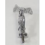 A vintage car mascot in the form of the Spirit of Ecstasy,