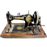 A cased Jones sewing machine.
