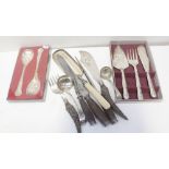 A boxed plated set of fish servers and cake slice, a cased set of fruit servers, crumb scoop,