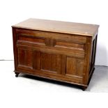 A 19th century oak panel chest with strap hinges, width 112cm.