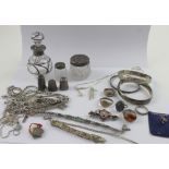 A collection of silver jewellery, thimbles and dressing table furniture to include silver bangles,