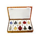 A cased set of ten Chinese snuff bottles to include resin, glass, ceramic and hand-painted examples,