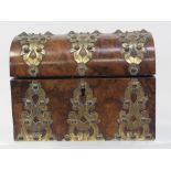 A 19th century burr walnut two-section tea caddy in the form of a treasure chest with brass