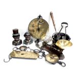 A group of various Sadler spring balance scales, an iron cauldron,