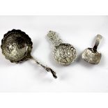 Three hallmarked silver caddy spoons, a Joseph Wilmore, George III, Birmingham 1822 example,