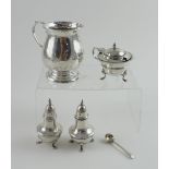 A hallmarked silver Christening mug (af), a pair of hallmarked silver pepper pots,