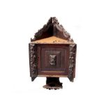 A 19th century oak carved wall hanging corner unit,