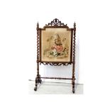 A late Victorian rosewood fire screen with fine point tapestry panel of young girl feeding a parrot