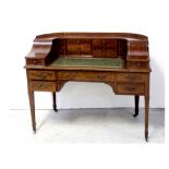 An Edward VII mahogany and satinwood crossbanded Carlton House desk by Maple & Co, London,