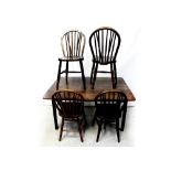 A 19th century mahogany drop-leaf table to reeded supports,