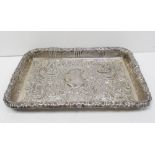 An Edward VII hallmarked silver rectangular dish with repoussé floral and foliate decoration,