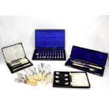 A cased set of eleven fruit knives with hallmarked silver pistol handles,