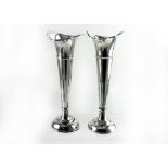 A pair of George V hallmarked silver trumpet vases to stepped circular base, Walker & Hall ,