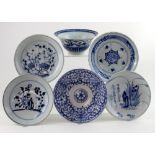 A group of five late 19th early 20th century Chinese blue and white plates and a bowl,