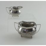 A Victorian hallmarked silver sucrier and matching creamer, London 1894, maker's mark rubbed,