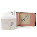 An autograph book containing various autographs to include a loose leaf with the autograph of