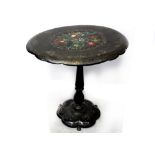 A Victorian papier mâché black painted oval table with hand-painted flora to the centre,