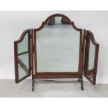 An early 20th century mahogany triple freestanding dressing table mirror on curved supports.