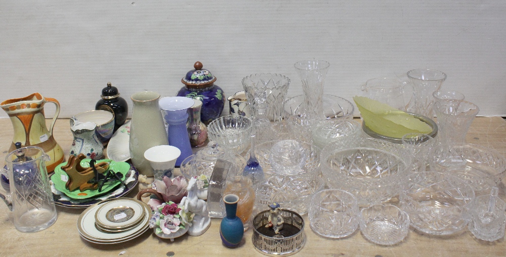 A quantity of cut glass and crystal to include bowls of varying sizes, water jug, vase, glass bell,