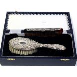 A cased Elizabeth II hallmarked silver millennium child's brush and comb set, B & Co,