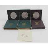 Three boxed Festival of Britain commemorative crowns, two in green boxes, one in purple box (3).