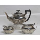 An Edward VII hallmarked silver three-piece tea service, J.W.B, Sheffield 1901, combined approx 41.